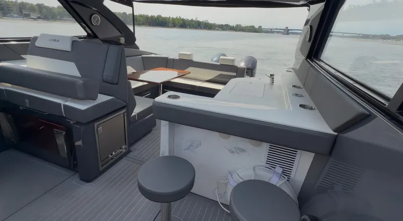 Slide: The Image of Interior of 2023 Cruisers Yachts 42 GLS on water. - 17