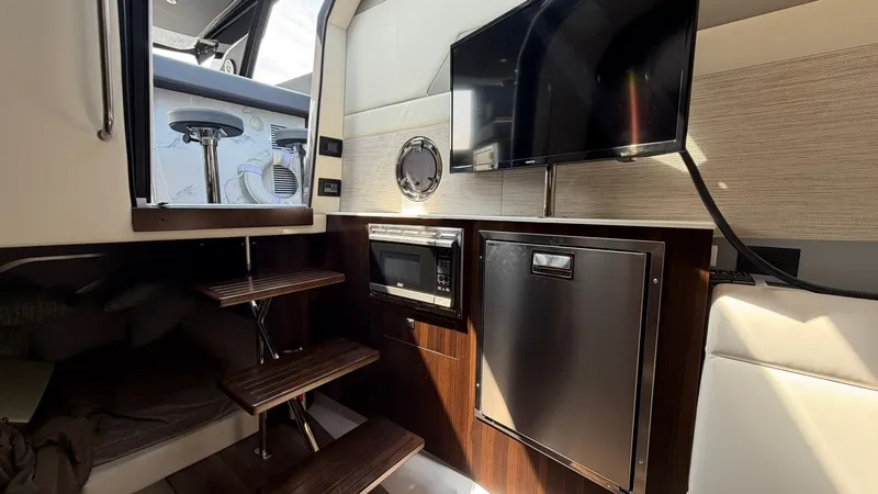 Slide: The Image of Interior of 2023 Cruisers Yachts 42 GLS with TV and kitchenette. - 27