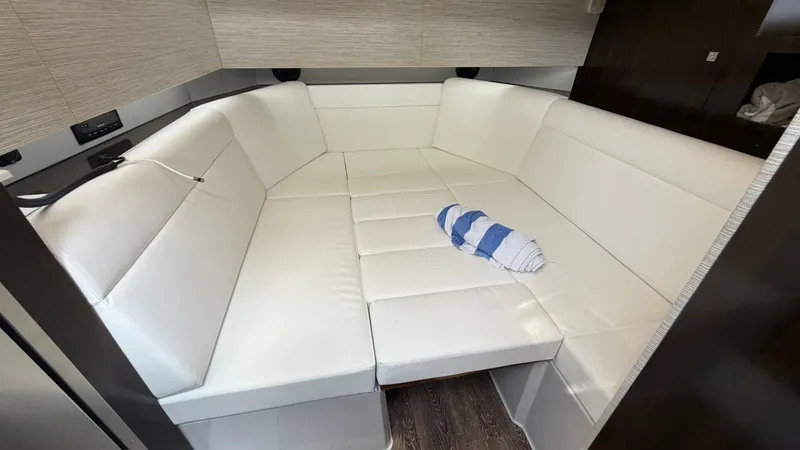 Slide: The Image of Interior of 2023 Cruisers Yachts 42 GLS with white sofa. - 29