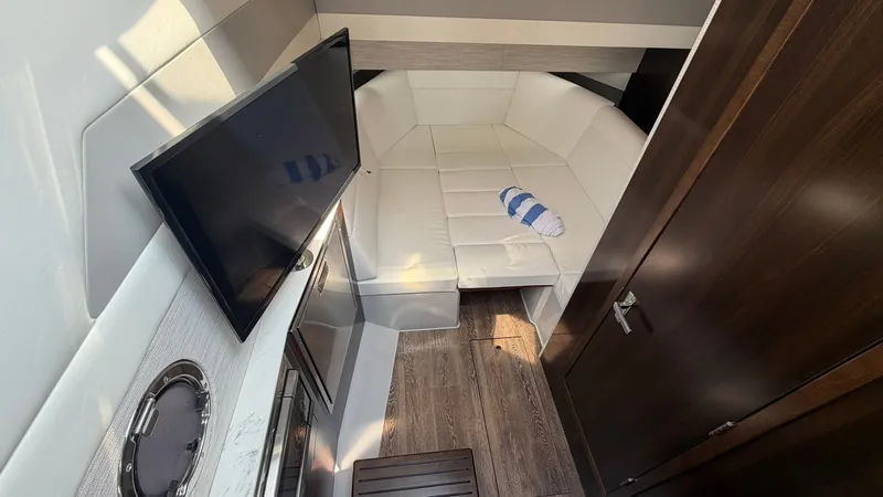 Slide: The Image of Interior of 2023 Cruisers Yachts 42 GLS with sofa and TV. - 30