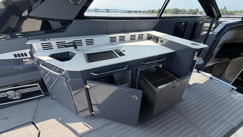Slide: The Image of Luxurious onboard kitchen on the 2023 Cruisers Yachts 42 GLS. - 47