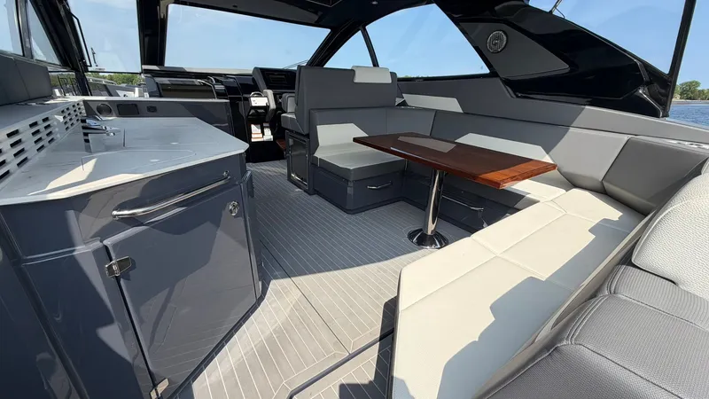 Slide: The Image of Interior of 2023 Cruisers Yachts 42 GLS with sleek seating area. - 48