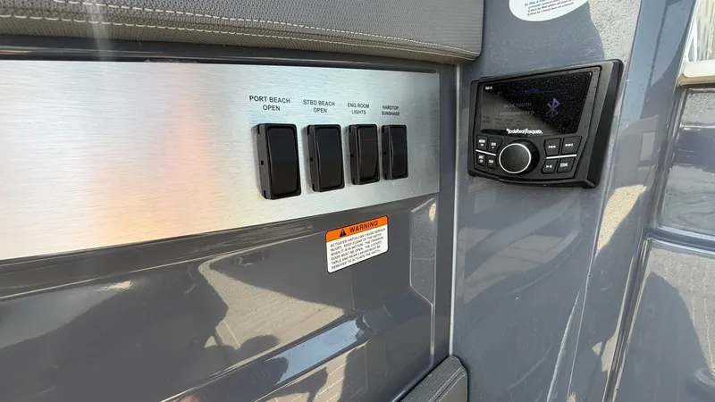 Slide: The Image of Control panel and Bluetooth system on 2023 Cruisers Yachts 42 GLS. - 49