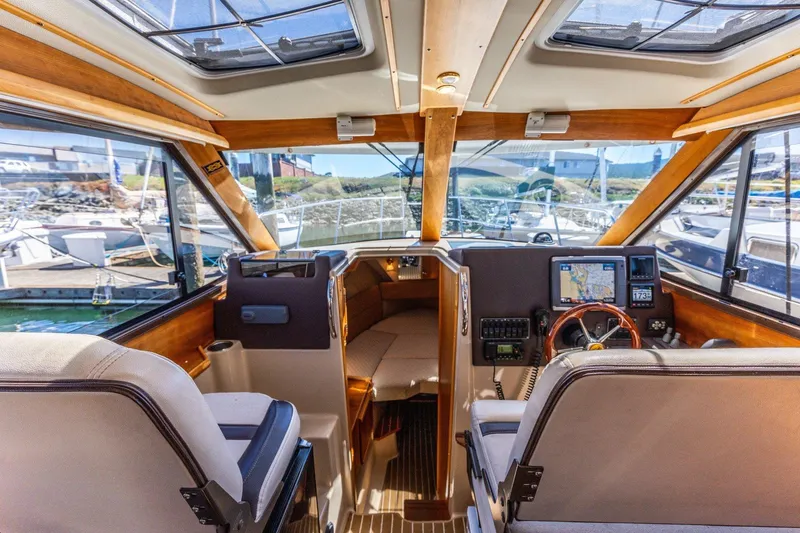 Slide: The Image of Interior view of a 2015 Cutwater 28 boat cockpit with navigation equipment. - 6