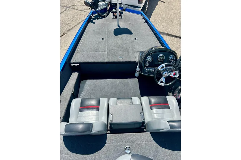 Slide: The Image of 2017 Triton 18 C TX boat interior with dual seats and steering console. - 15