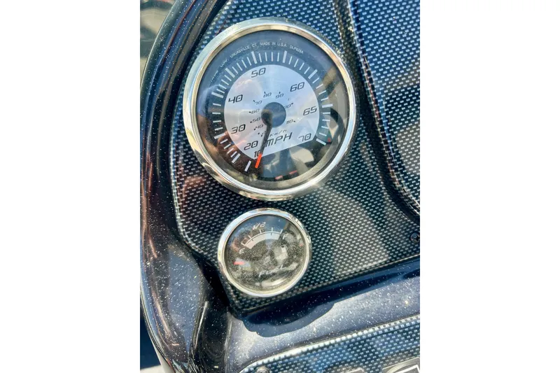 Slide: The Image of Dashboard of 2017 Triton 18 C TX boat with speedometer and gauge. - 18