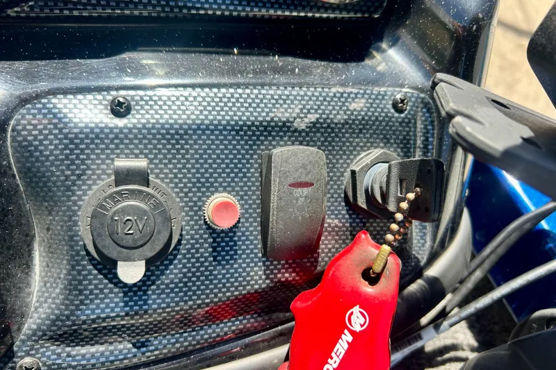 Slide: The Image of Dashboard of a 2017 Triton 18 C TX boat with 12V marine socket. - 20