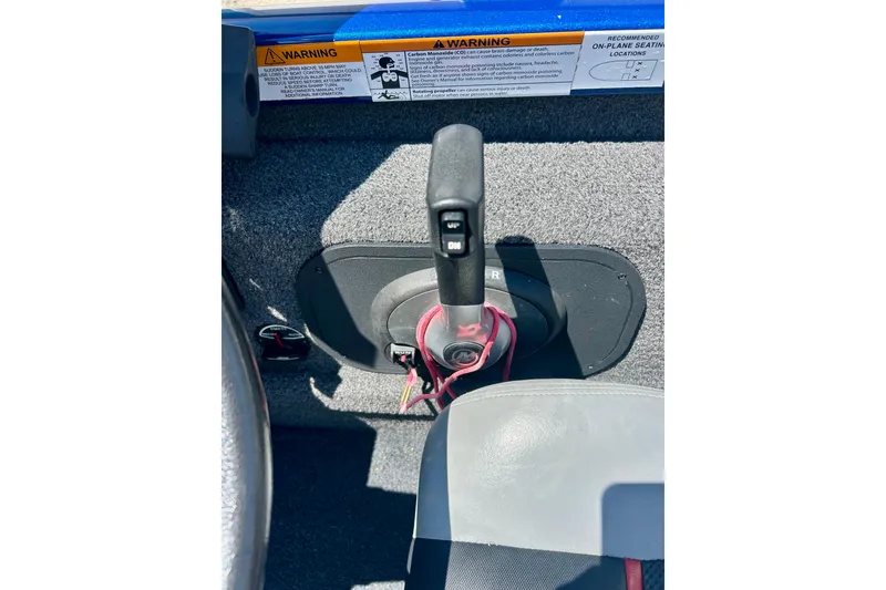 Slide: The Image of 2017 Triton 18 C TX boat throttle control with warning labels visible. - 21