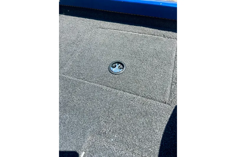 Slide: The Image of Carpeted deck of 2017 Triton 18 C TX boat with storage hatch. - 25