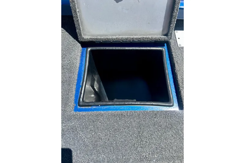 Slide: The Image of Open storage compartment on 2017 Triton 18 C TX boat deck. - 26