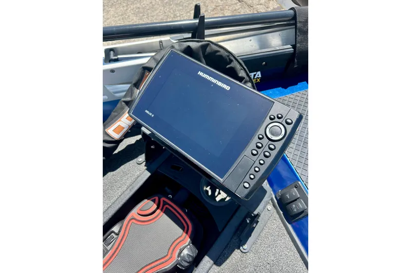 Slide: The Image of Fishfinder on 2017 Triton 18 C TX boat, featuring Humminbird Helix 9 display. - 41