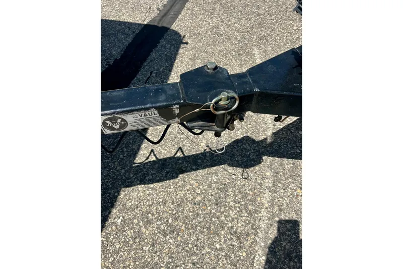 Slide: The Image of Trailer hitch of a 2017 Triton 18 C TX on asphalt surface. - 45