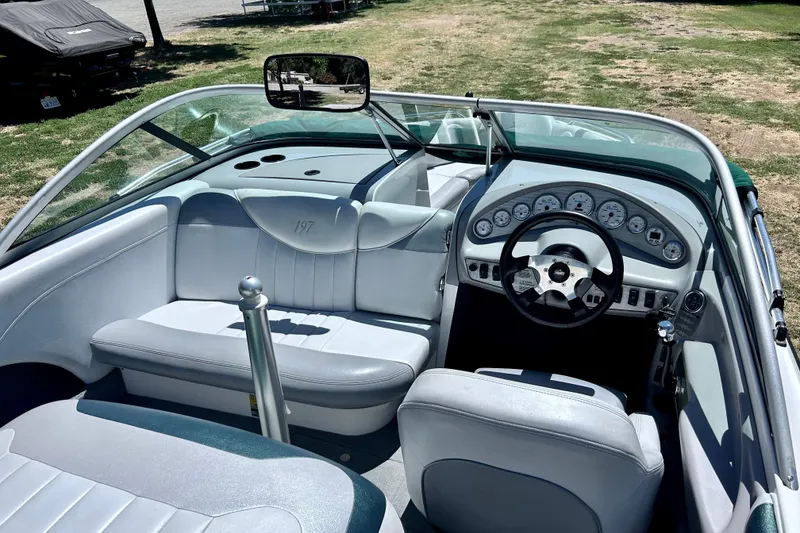 Slide: The Image of 2002 MasterCraft ProStar 197 boat interior with sleek dashboard and comfortable seating. - 10