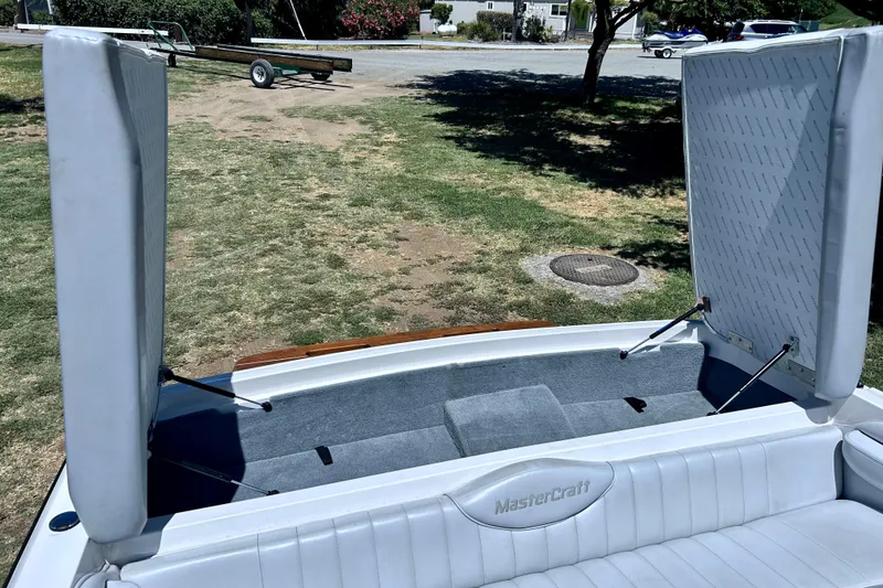 Slide: The Image of 2002 MasterCraft ProStar 197 boat interior with open storage compartments. - 9