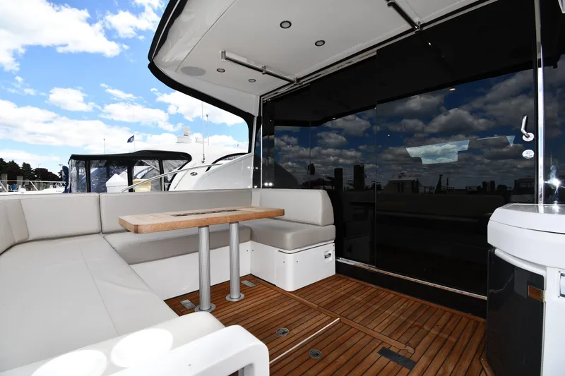 Slide: The Image of Luxurious 2024 Fairline G50 Targa yacht interior with sleek seating and wooden flooring. - 13