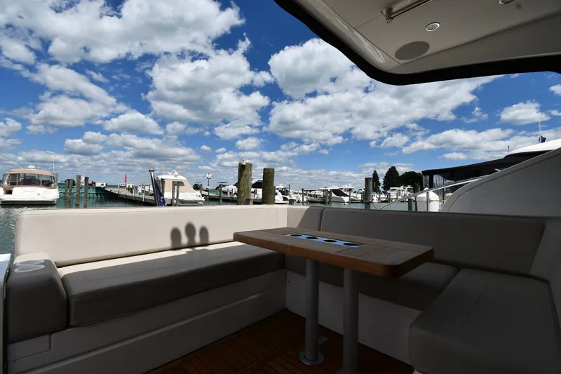 Slide: The Image of 2024 Fairline G50 Targa yacht interior with marina view under blue sky. - 16