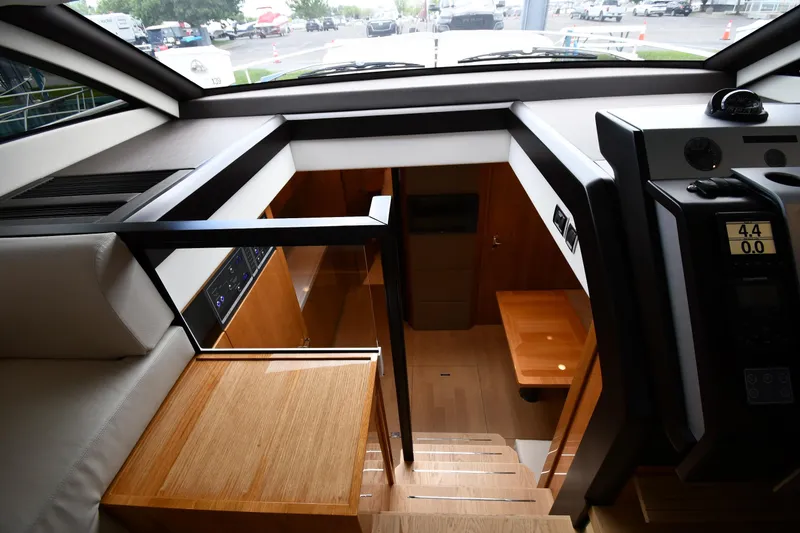 Slide: The Image of Interior view of 2024 Fairline G50 Targa yacht, showcasing modern design and wooden finishes. - 17