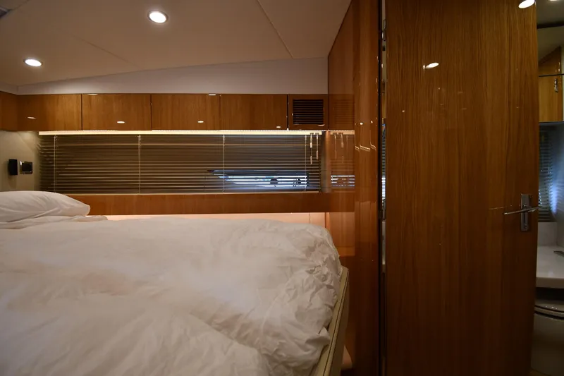Slide: The Image of Luxurious cabin interior of 2024 Fairline G50 Targa yacht with elegant wood finishes. - 21