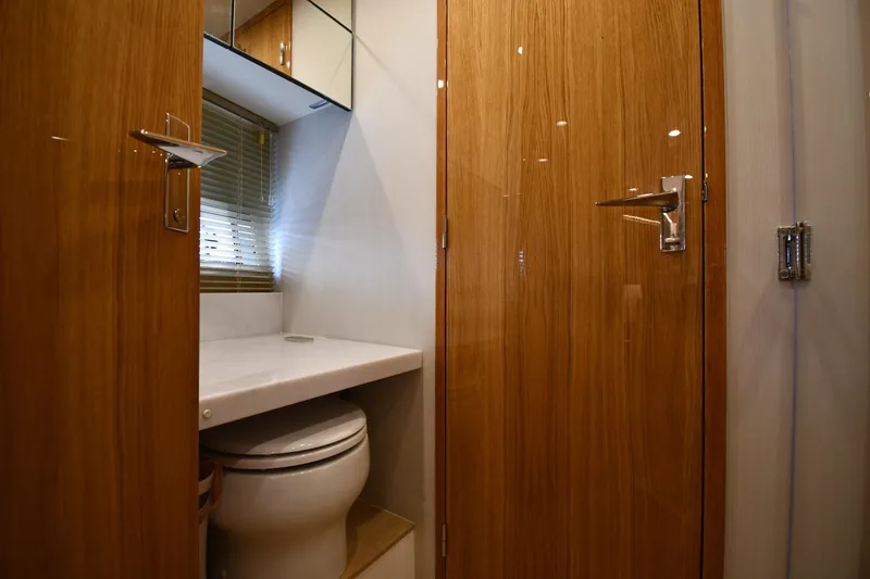 Slide: The Image of Luxurious bathroom interior of 2024 Fairline G50 Targa yacht with wooden doors and modern fixtures. - 26