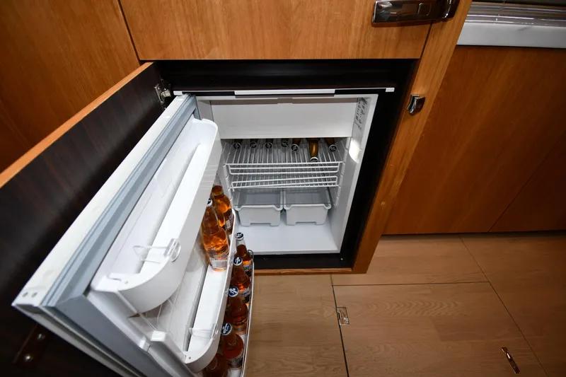 Slide: The Image of Open fridge in 2024 Fairline G50 Targa yacht, stocked with beverages. - 34