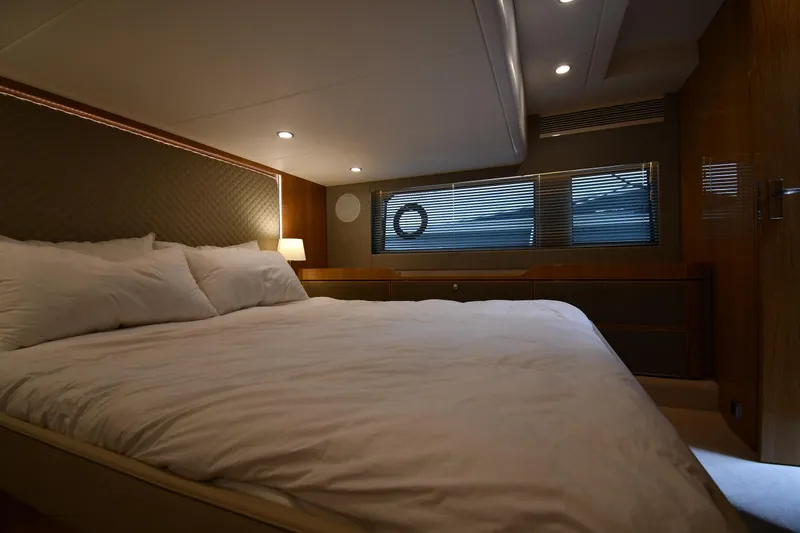 Slide: The Image of Luxurious bedroom interior of 2024 Fairline G50 Targa yacht with modern lighting and cozy bedding. - 38