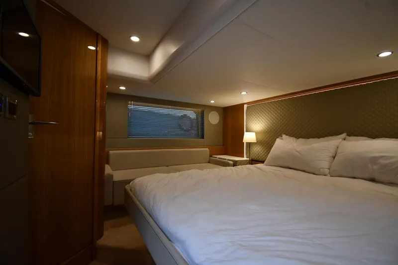 Slide: The Image of Luxurious cabin interior of 2024 Fairline G50 Targa yacht with cozy bed and ambient lighting. - 39