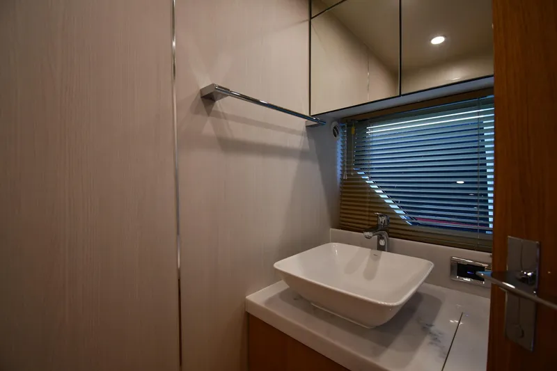 Slide: The Image of Modern bathroom interior of 2024 Fairline G50 Targa yacht with sleek sink and blinds. - 43