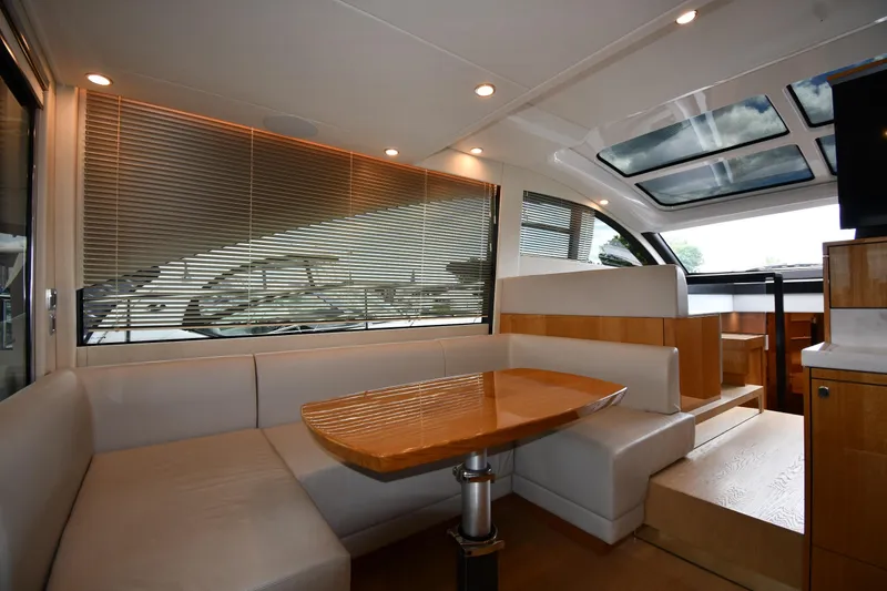 Slide: The Image of Luxurious interior of 2024 Fairline G50 Targa yacht with elegant seating and wooden table. - 46