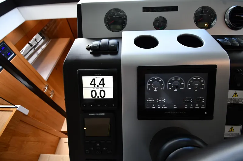 Slide: The Image of Dashboard of 2024 Fairline G50 Targa yacht with digital displays and controls. - 51