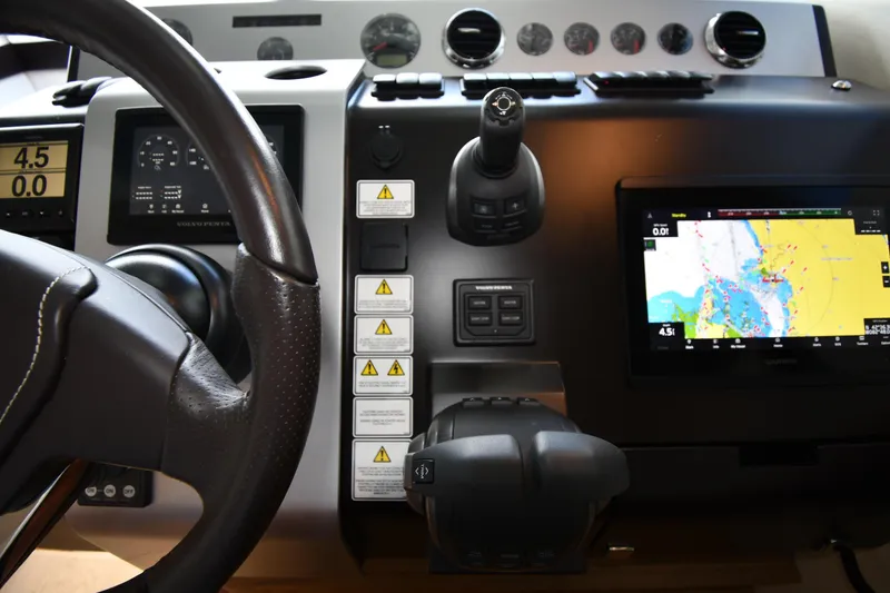 Slide: The Image of Cockpit of 2024 Fairline G50 Targa yacht with navigation and control systems. - 52