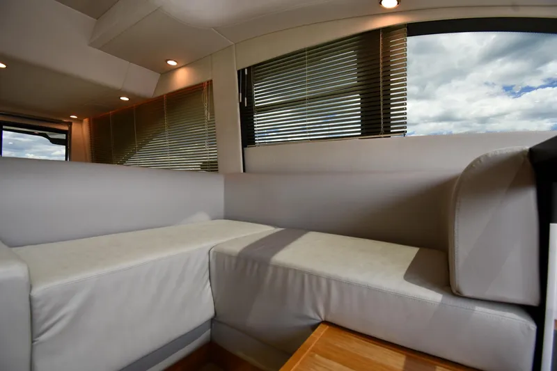 Slide: The Image of Luxurious interior of 2024 Fairline G50 Targa yacht with modern seating and large windows. - 56