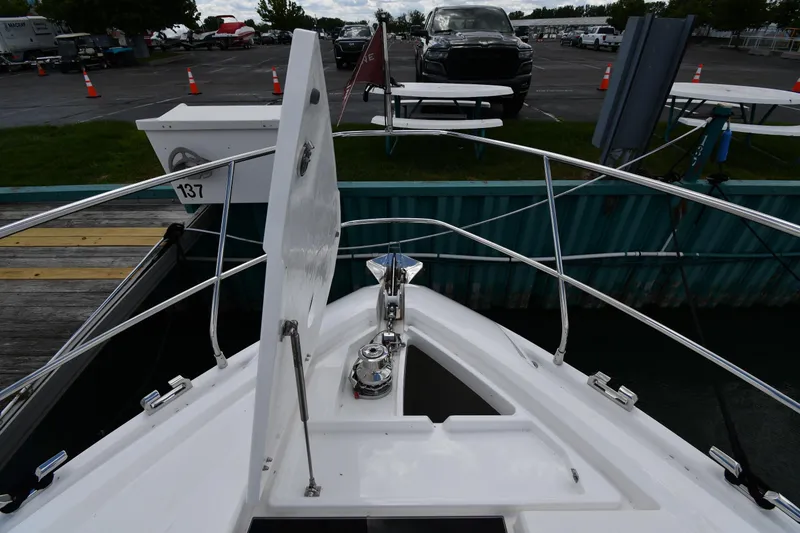 Slide: The Image of 2024 Fairline G50 Targa yacht bow with anchor and railing at dock. - 6