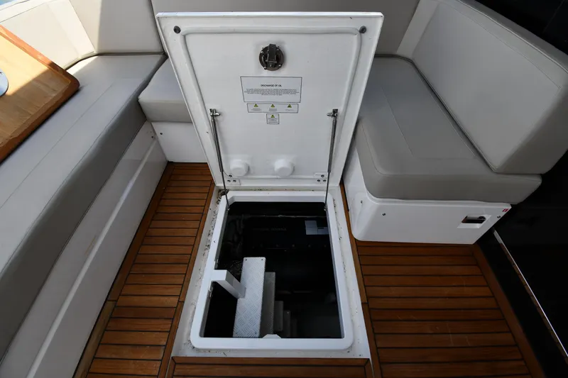 Slide: The Image of Open hatch on 2024 Fairline G50 Targa yacht, revealing engine compartment. - 61