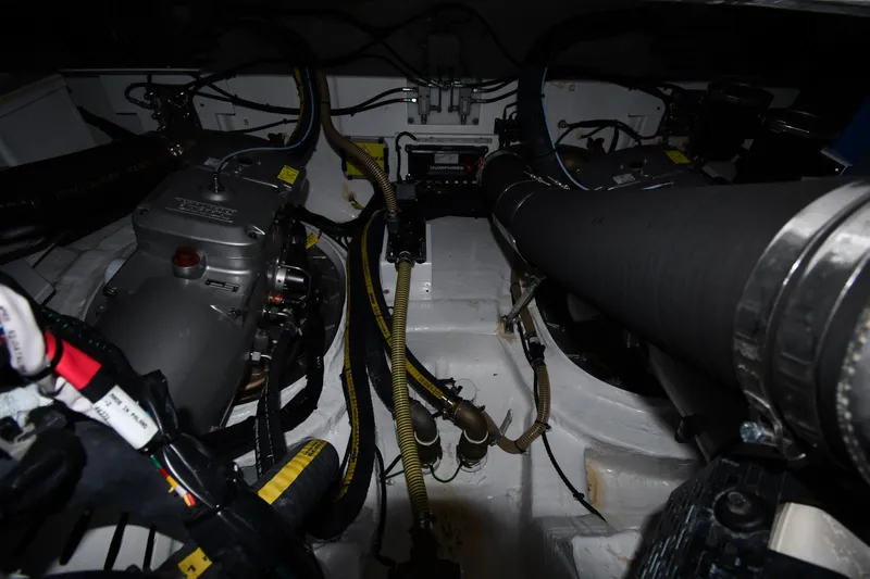 Slide: The Image of Engine room of 2024 Fairline G50 Targa yacht, showcasing mechanical components and wiring. - 65