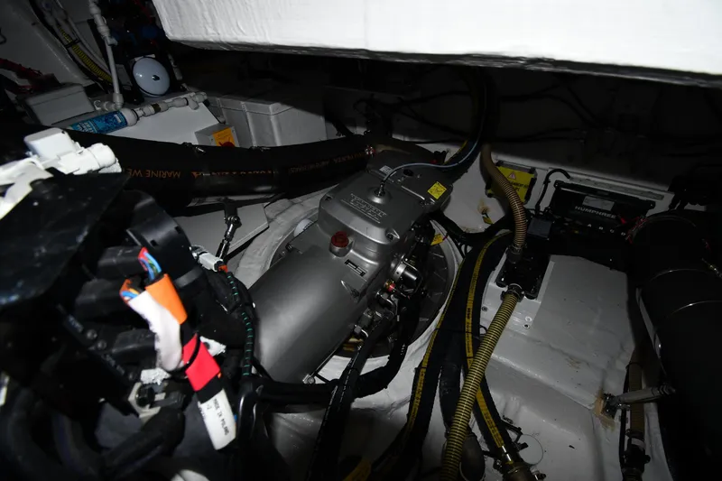 Slide: The Image of Engine room of 2024 Fairline G50 Targa yacht, showcasing mechanical components and wiring. - 67