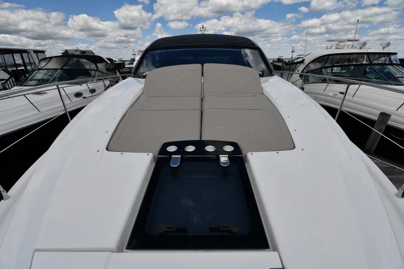 Slide: The Image of 2024 Fairline G50 Targa yacht with sleek deck design under a cloudy sky. - 8