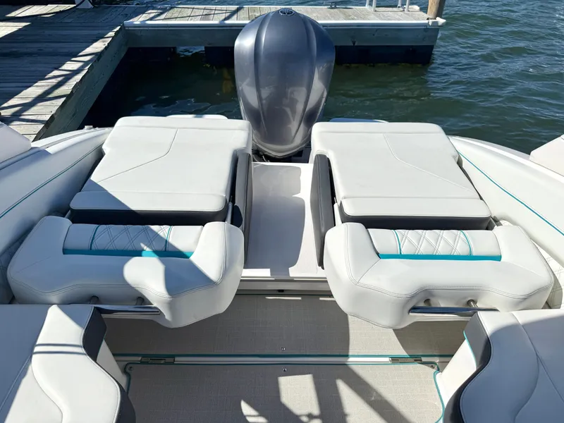 Slide: The Image of Regal LX4 2022 boat with luxurious seating by the water. - 10