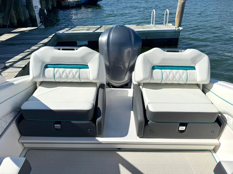 Slide: The Image of Regal LX4 2022 boat with luxurious seating at the dock. - 11