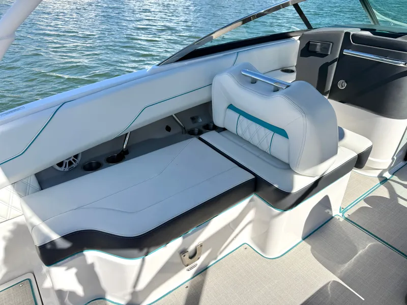 Slide: The Image of Interior of a 2022 Regal LX4 boat on the water. - 14