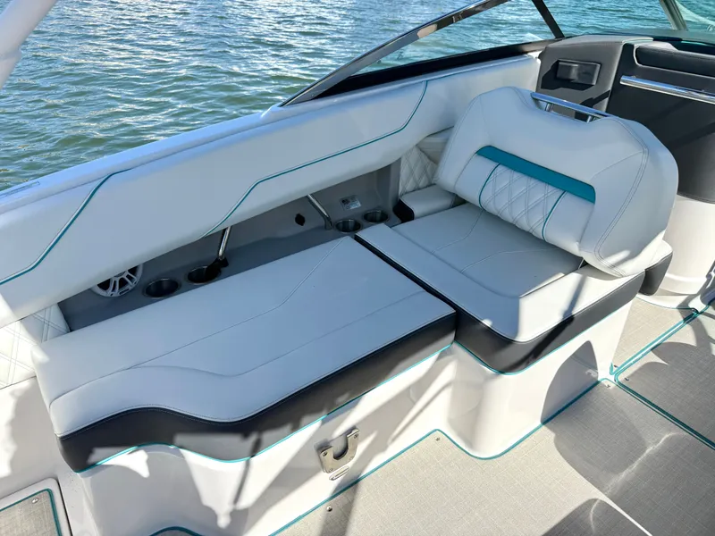 Slide: The Image of Interior of a 2022 Regal LX4 boat with luxurious seating. - 15