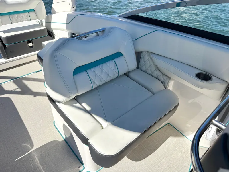 Slide: The Image of Interior of a 2022 Regal LX4 boat with luxurious seating. - 16