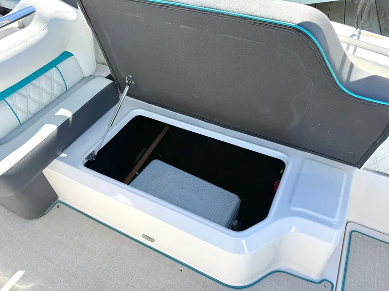 Slide: The Image of Regal LX4 2022 boat with open storage compartment. - 20