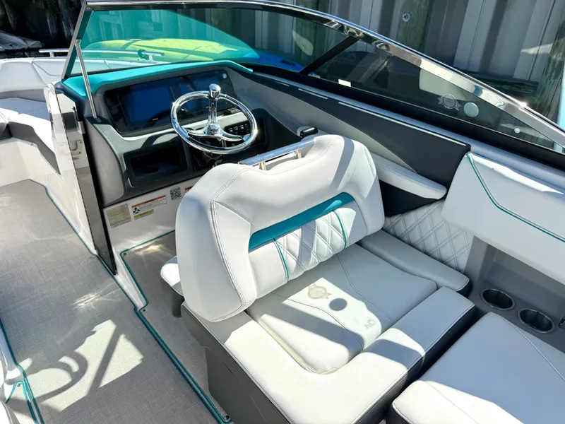 Slide: The Image of Interior view of a 2022 Regal LX4 boat helm. - 24