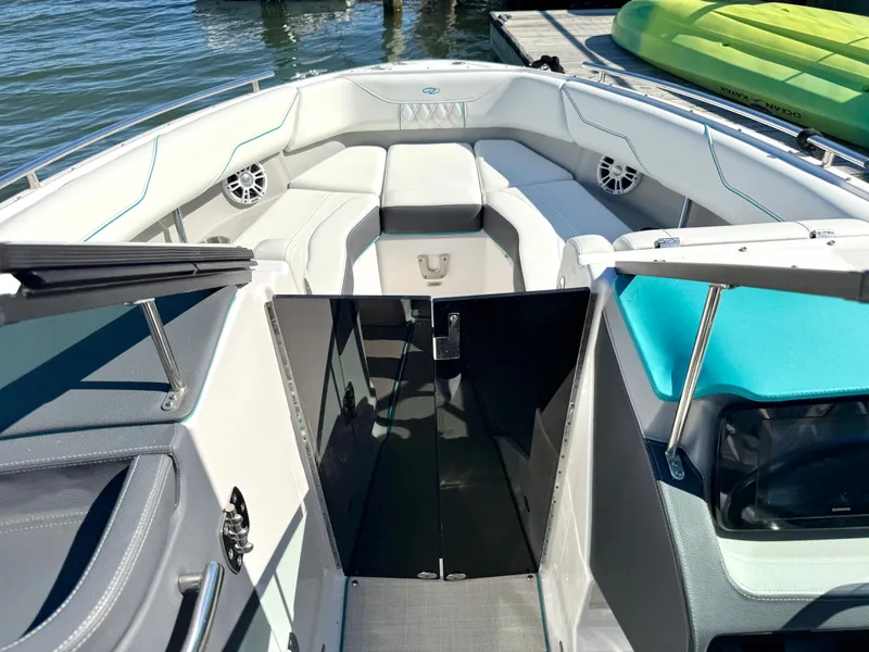 Slide: The Image of Interior view of a 2022 Regal LX4 boat on water. - 28