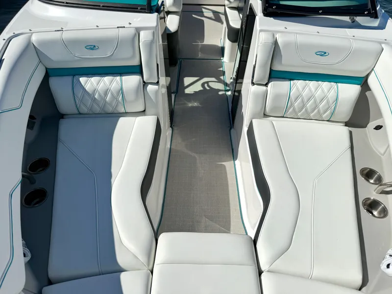 Slide: The Image of Interior of a 2022 Regal LX4 boat with luxurious white seating. - 30
