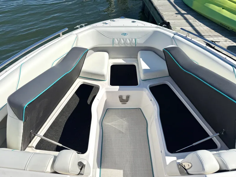 Slide: The Image of Interior of a 2022 Regal LX4 boat at the dock. - 31