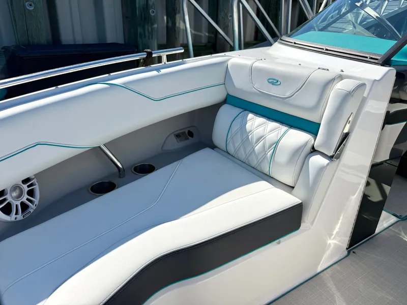 Slide: The Image of Interior of a 2022 Regal LX4 boat with white upholstery. - 32