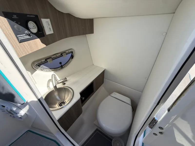 Slide: The Image of Interior of a 2022 Regal LX4 with toilet and sink. - 35