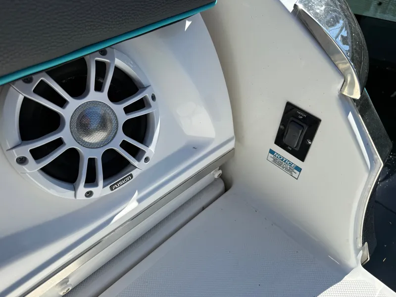 Slide: The Image of Regal LX4 2022 boat speaker and switch close-up. - 38