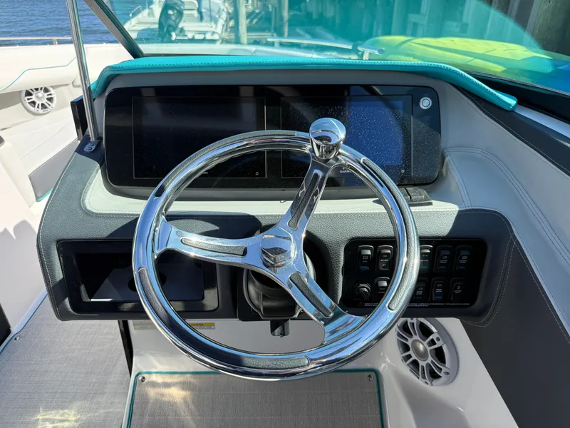 Slide: The Image of Regal LX4 2022 boat at dock with outboard motor. - 4